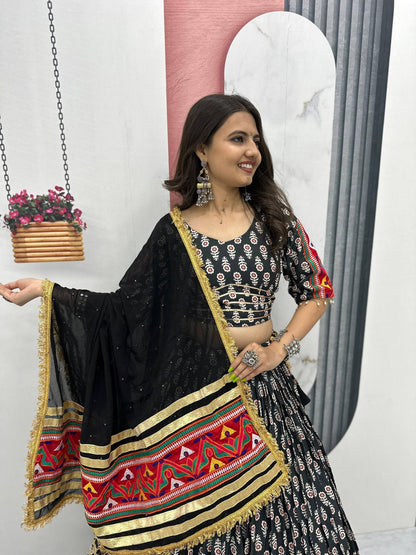Closeup of model in Gamathi Glam lehenga choli, highlighting ribbon work and bold lace on dupatta.