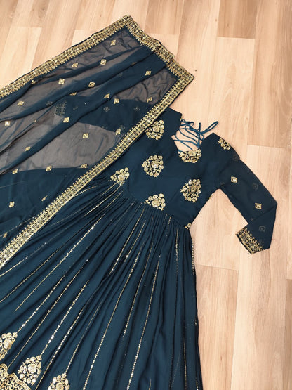 Rama green Indian gown with dupatta showcasing zari and sequin detailing.