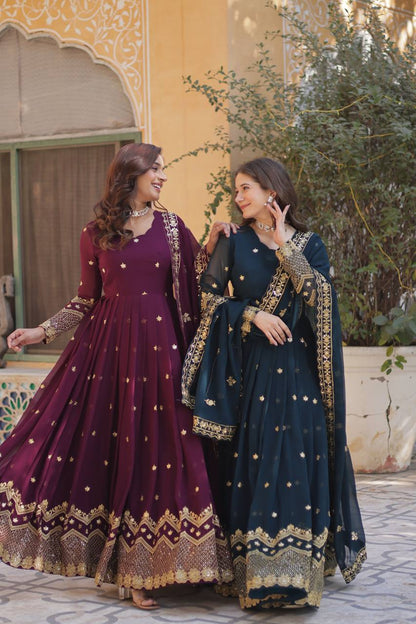 Plum and teal Anarkali gowns with intricate embroidery, perfect for weddings.