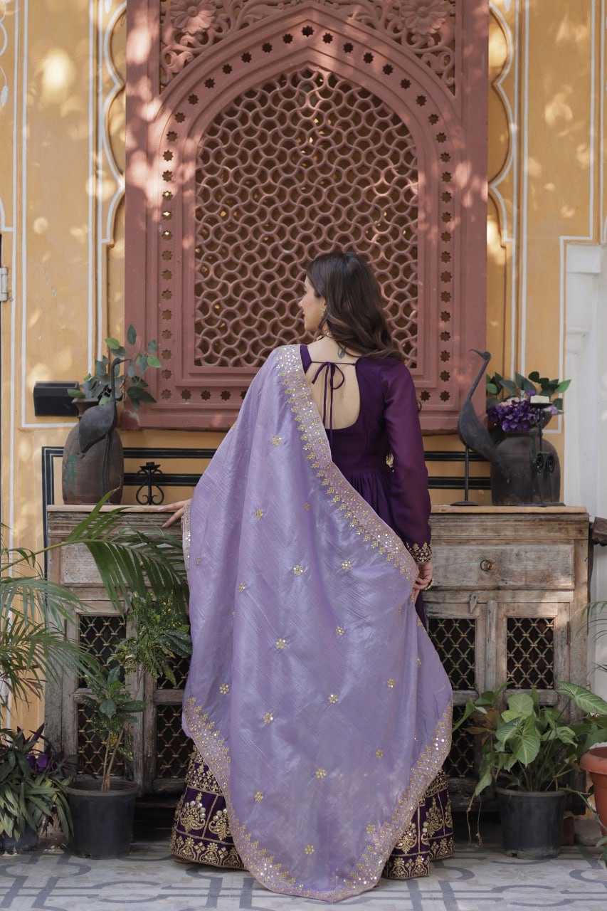 Back view of a purple gown with a gold embroidered dupatta.