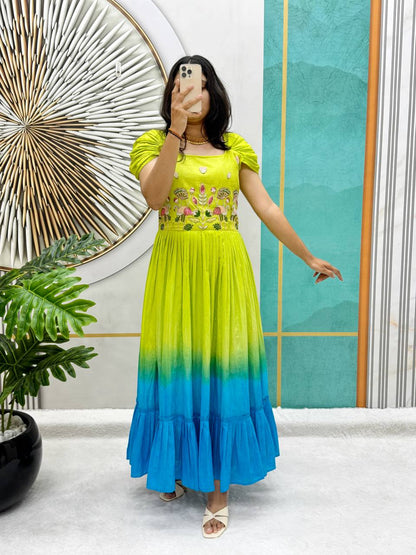 Model wearing a green and blue Festive Elegance Handworked Cotton Gown.