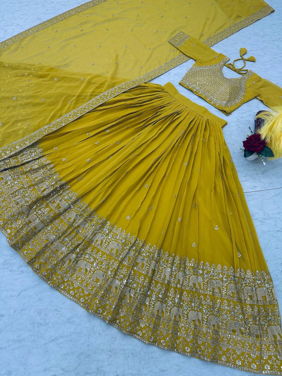 Overhead shot of the lime green lehenga choli set, highlighting the skirt's flair.