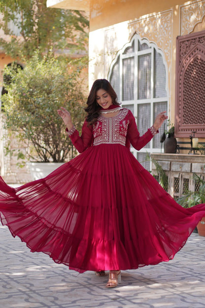Flowing red Georgette gown with pearl embroidery and wide flair.