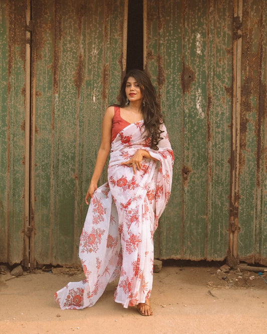 Off-white floral saree in georgette fabric, ready to wear, model wearing the saree.