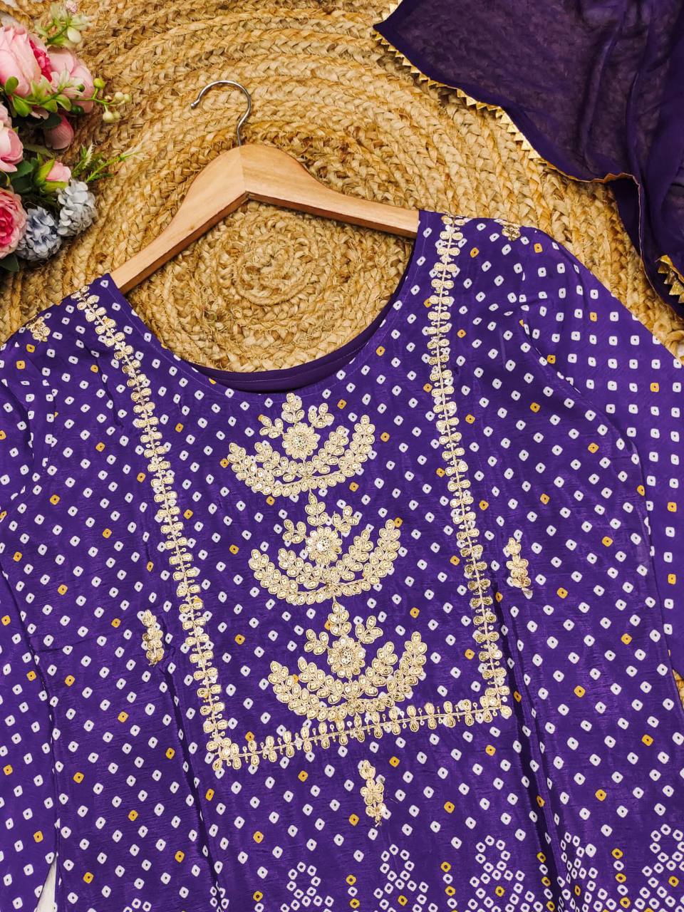 Close-up of the purple Chinon kurta with intricate Bandhani and gold embroidery.