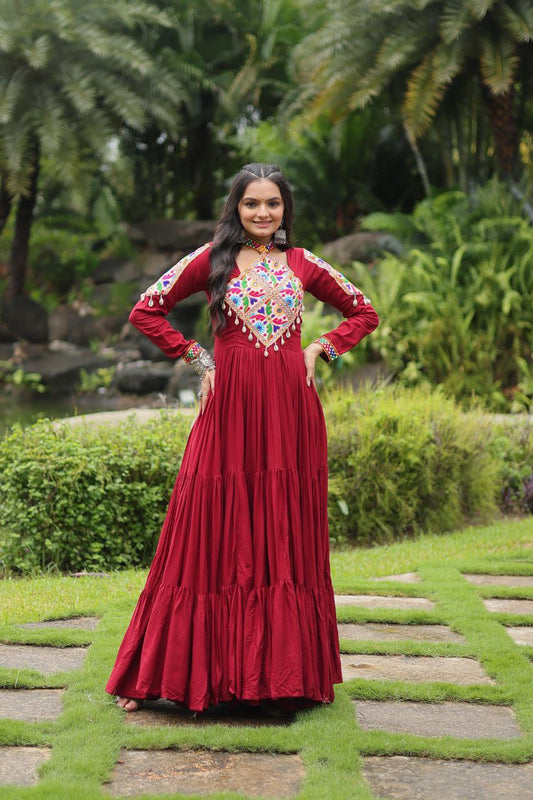 Maroon Gamthi Gown with vibrant Kutchi embroidery, long sleeves, and flared skirt, perfect for Navratri partywear.
