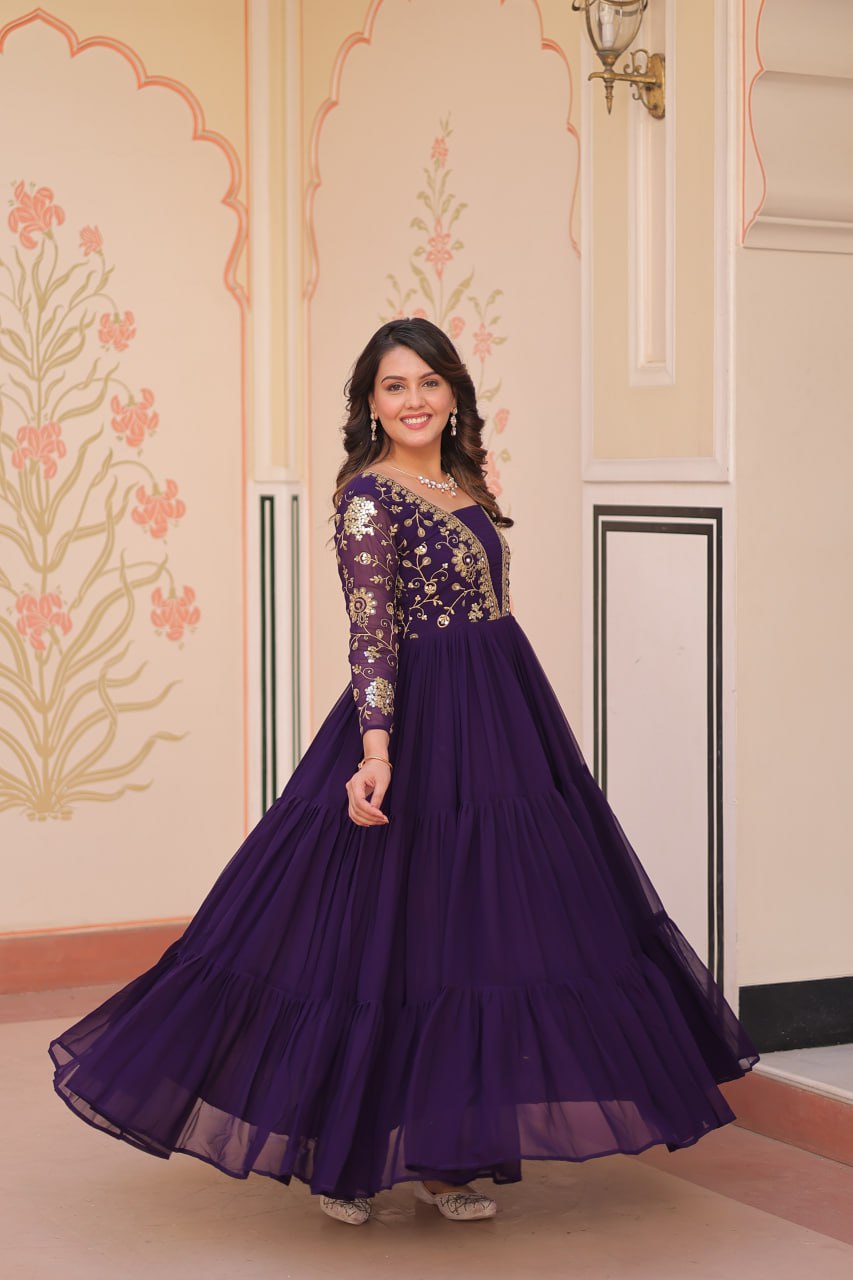 Green gown with full sleeves and layered design