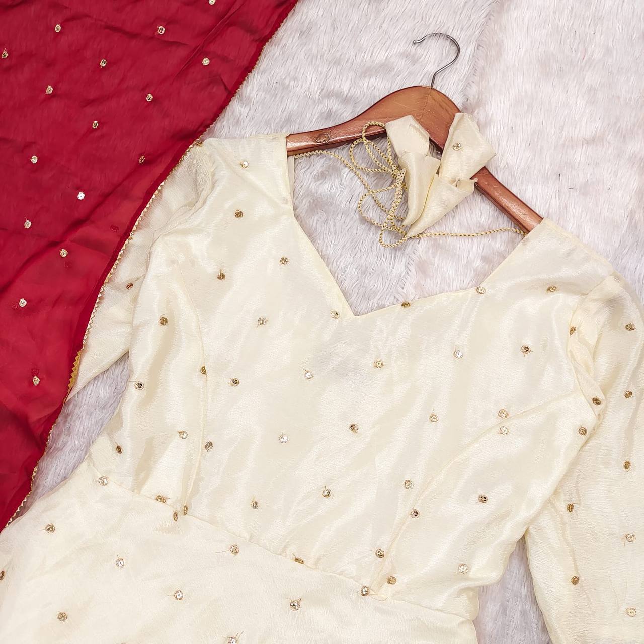 Close up flat lay of Red Victoria Suit Set.