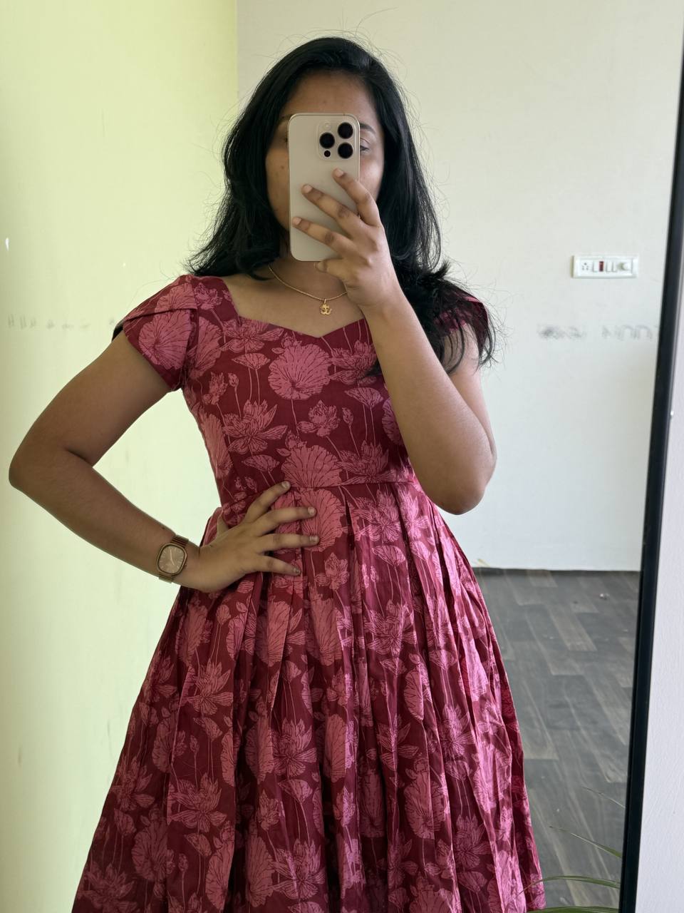 Model wearing Maroon Lotus dress. Comfortable and stylish floral dress for sunny days.