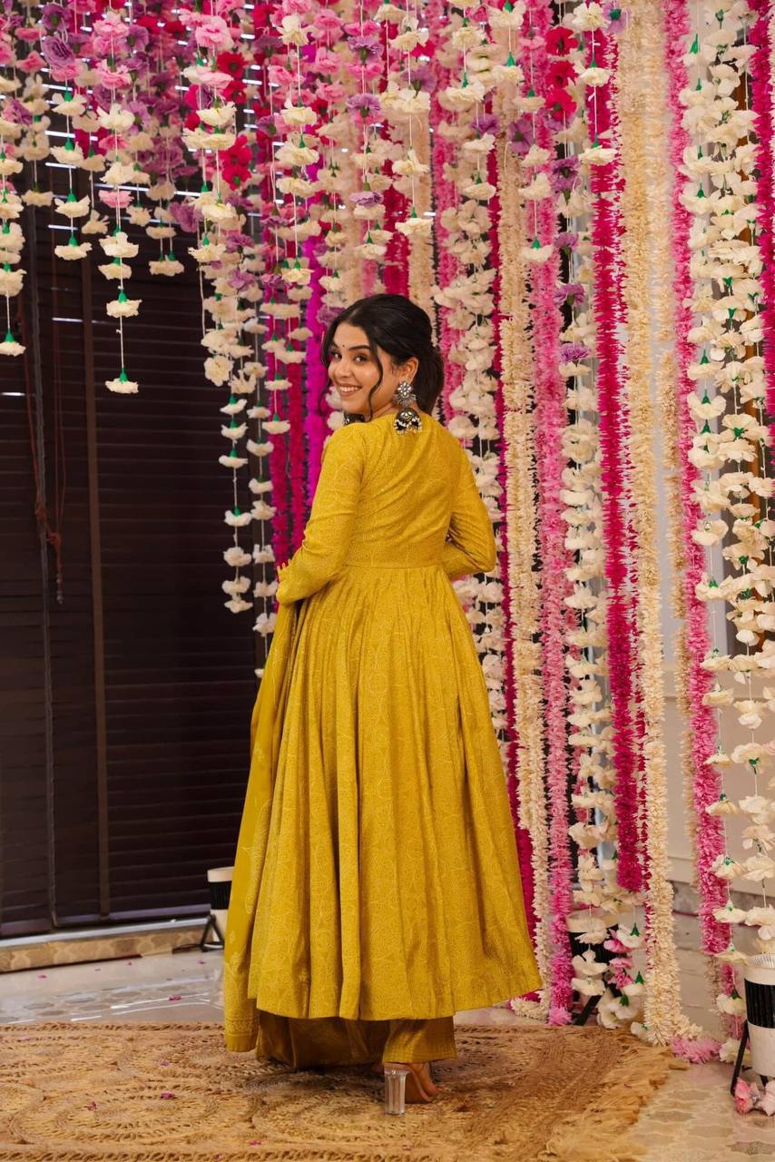 Back view of Golden Bandhani Anarkali Suit Set on woman. Ethnic dress.