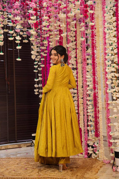 Back view of Golden Bandhani Anarkali Suit Set on woman. Ethnic dress.